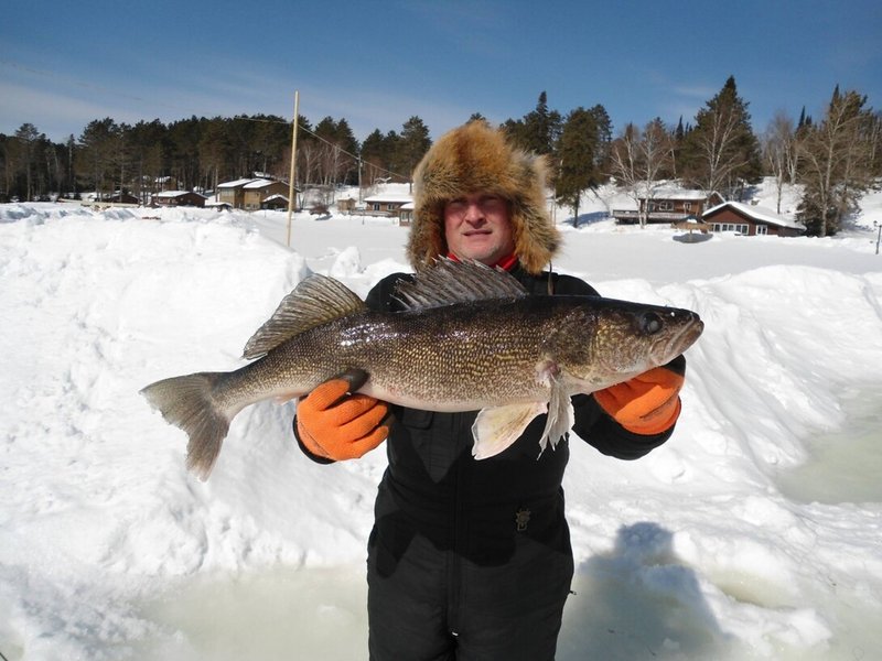 Image: Experience the Thrill of Ice Fishing in the Canadian Winter Wonderland